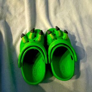 Monster/ Dinosaur crocs size 4c